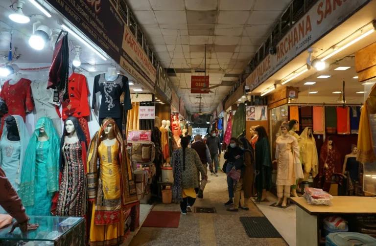 Garment shop interior with mannequins and clothing racks