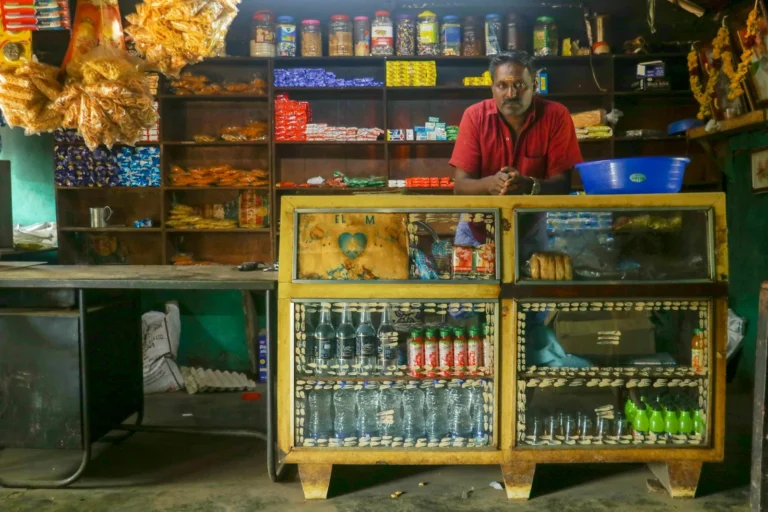 Owner standing inside a small neighbourhood shop