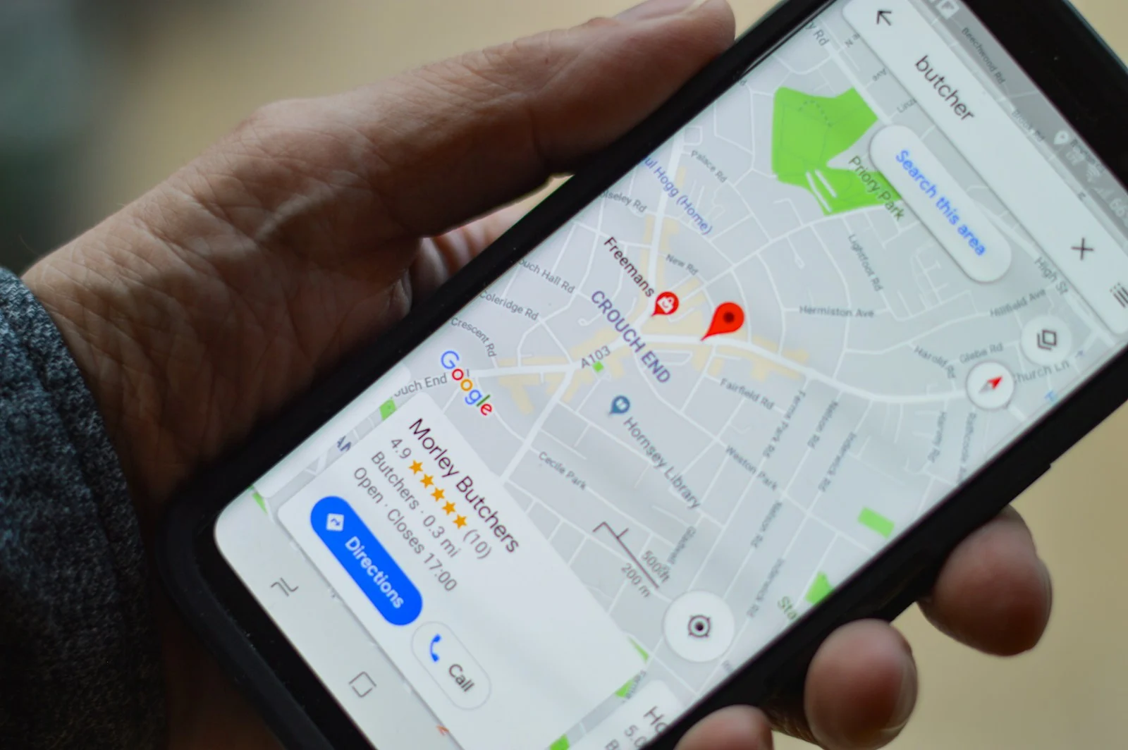 A Google Maps business listing open on a phone, showing star reviews and a directions button