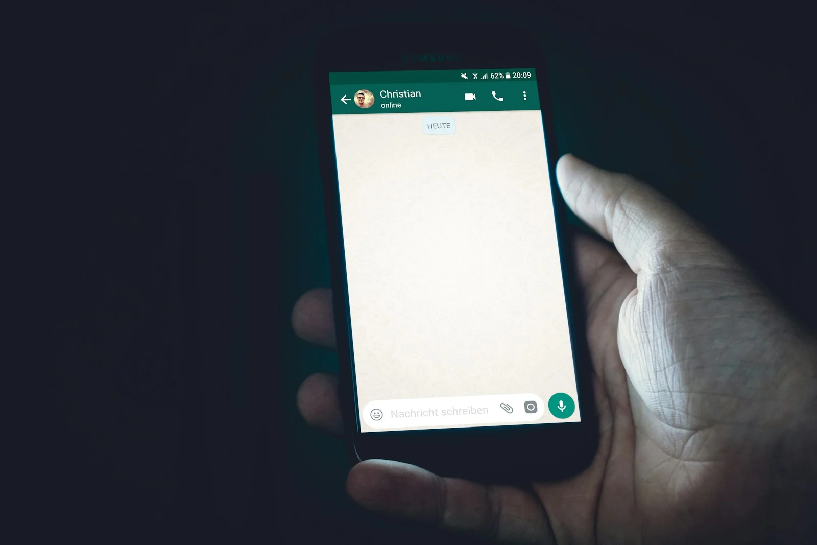 A WhatsApp chat open on a phone, the main customer channel for many Gurgaon businesses