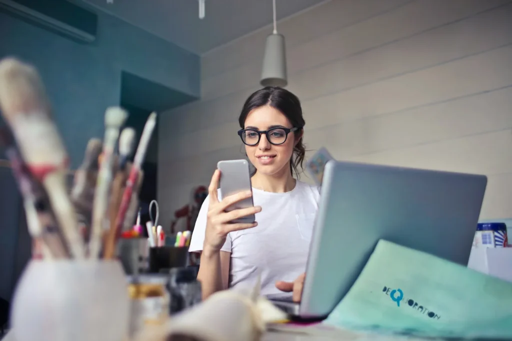 Business owner reading a customer review on her phone before calling an online reputation management company