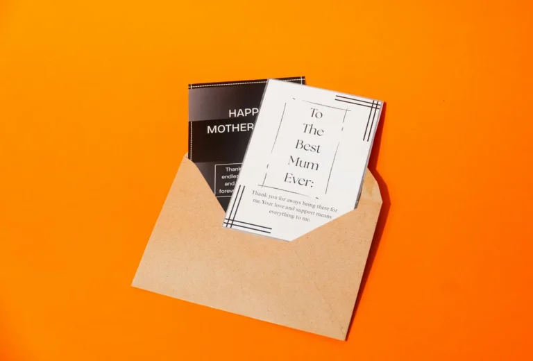 Envelope holding a greeting card on an orange background, like a welcome email