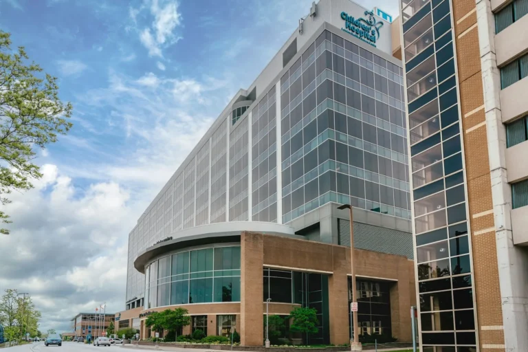 Modern hospital building with a glass facade under a blue sky, the location a Google Business Profile should show