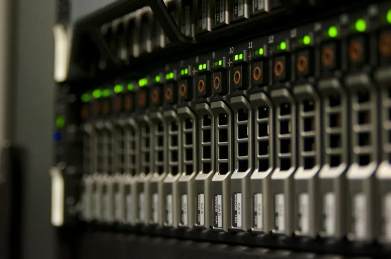 A server rack with green status lights, the hardware behind web hosting